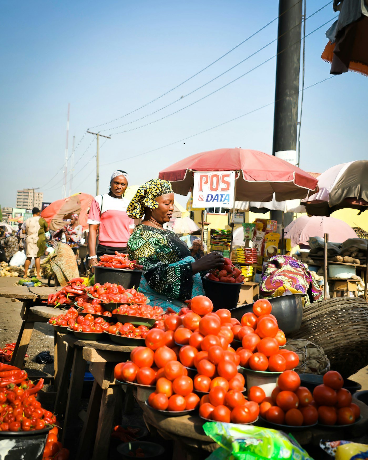 Cooperative members sorting produce at a West African market